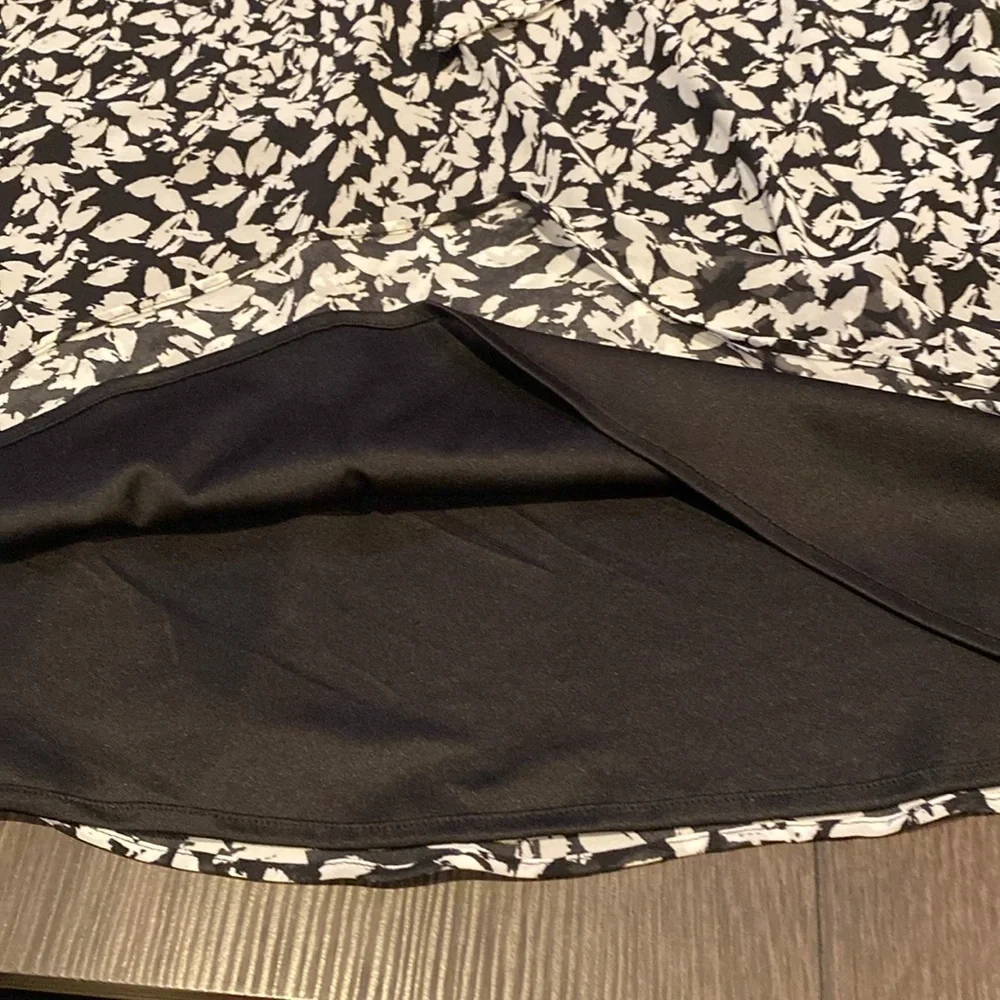 Karin Steven’s sleeveless black/white patterned lined dress. Tie at neck & waist